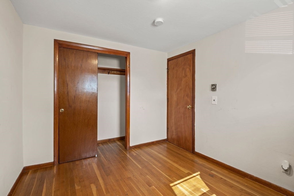 48 Hardwick Terrace Boston, MA 02135 - Photo 13 of 32 an empty room with closet and wooden floor