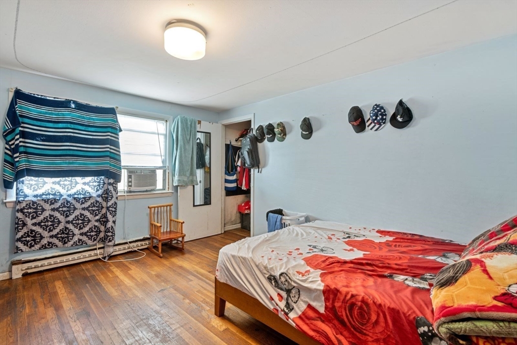 48 Hardwick Terrace Boston, MA 02135 - Photo 20 of 32 a bedroom with a bed and a window