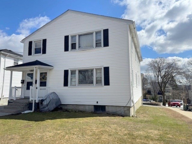 48 Hardwick Terrace Boston, MA 02135 - Photo 2 of 32 a front view of a house with a yard