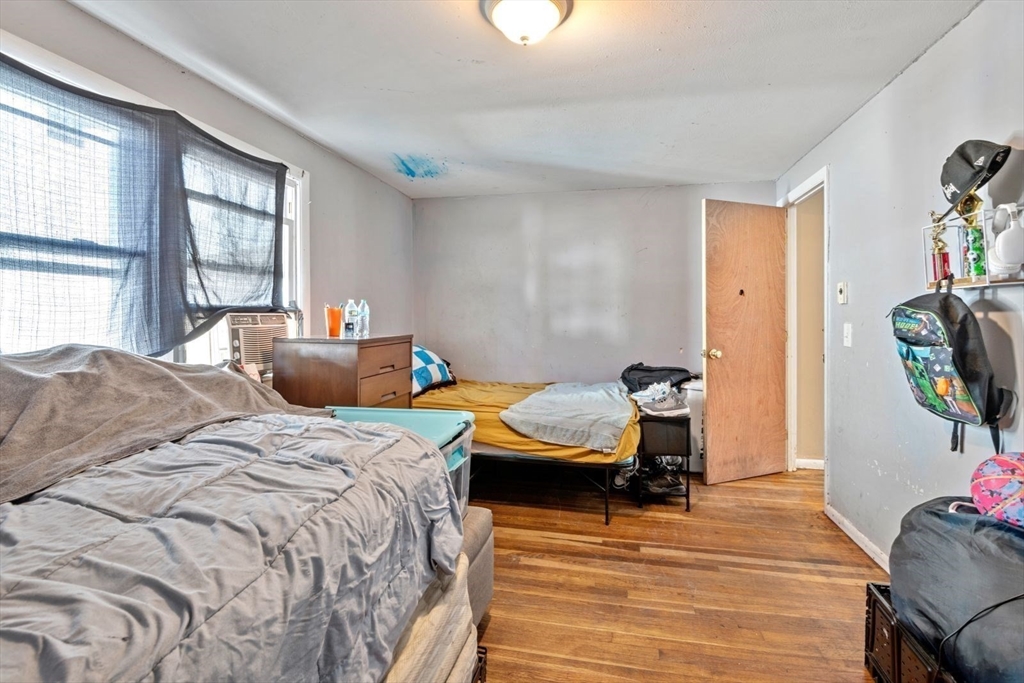 48 Hardwick Terrace Boston, MA 02135 - Photo 23 of 32 a bedroom with two beds and a window