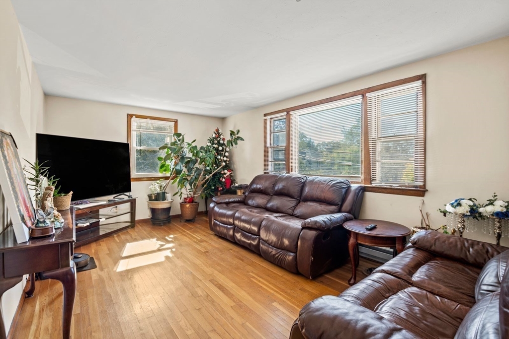 48 Hardwick Terrace Boston, MA 02135 - Photo 3 of 32 a living room with furniture and a flat screen tv
