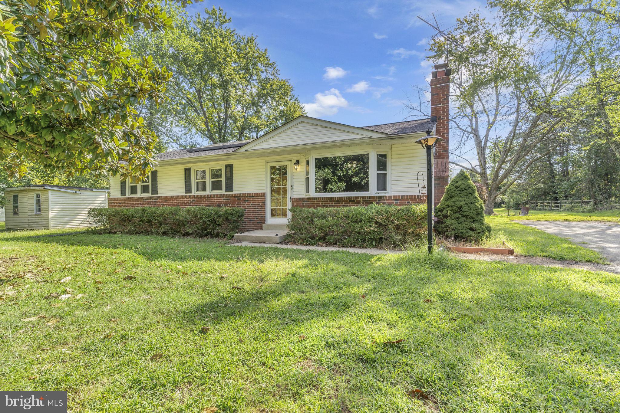 16500 Baden Naylor Road Brandywine, MD 20613 - Photo 2 of 37 a front view of a house with garden