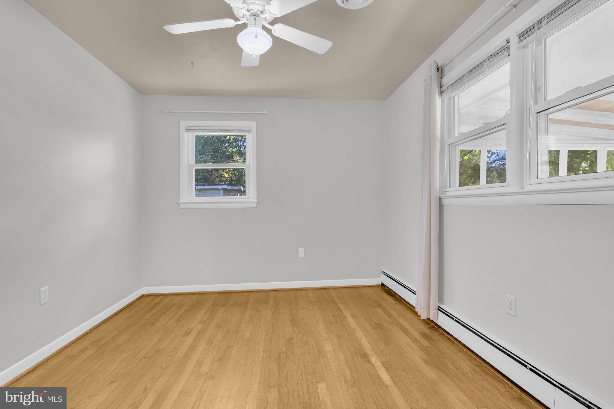 16500 Baden Naylor Road Brandywine, MD 20613 - Photo 21 of 37 wooden floor in an empty room with a window