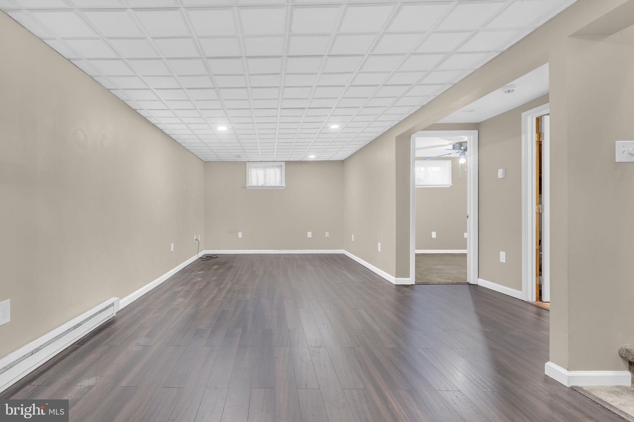 16500 Baden Naylor Road Brandywine, MD 20613 - Photo 24 of 37 wooden floor in an empty room with a window