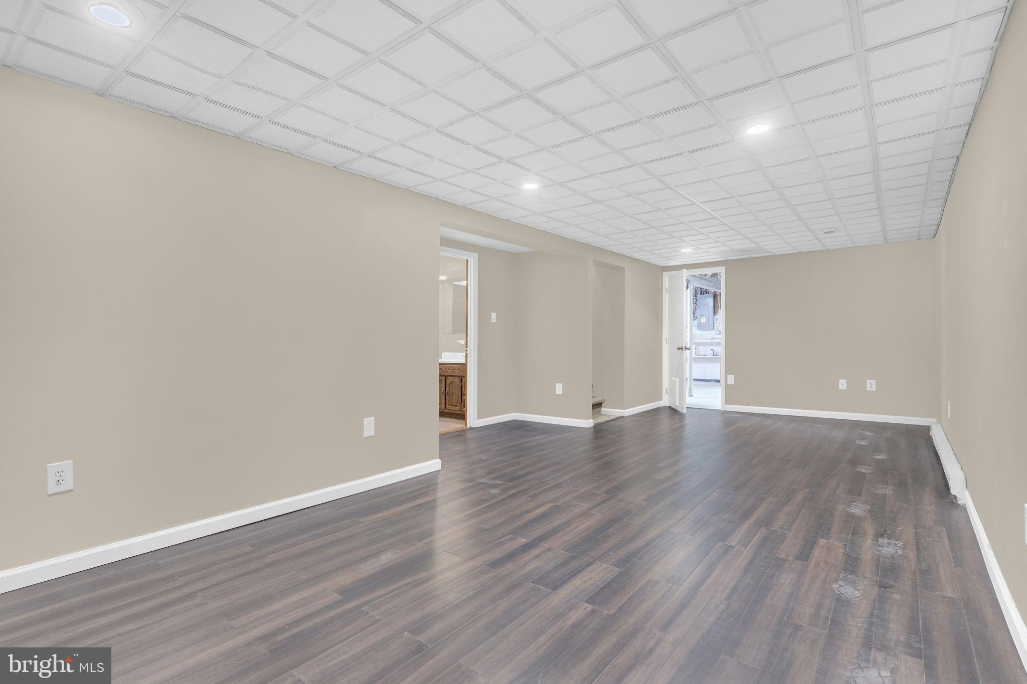 16500 Baden Naylor Road Brandywine, MD 20613 - Photo 25 of 37 a view of an empty room with wooden floor