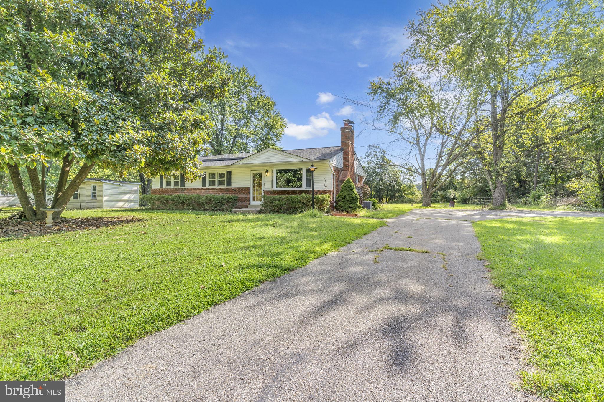 16500 Baden Naylor Road Brandywine, MD 20613 - Photo 4 of 37 a front view of a house with a yard