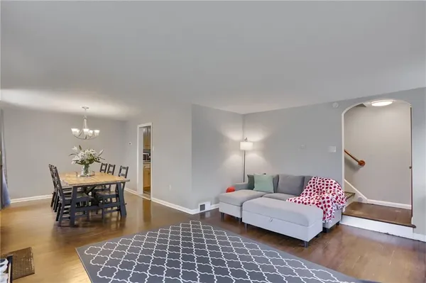 a bedroom with furniture and wooden floor