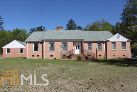 527 Flat Shoals Road Gay, GA 30218 - Photo 1 of 1 a front view of a house with a yard