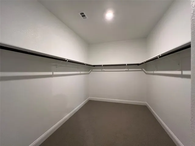 a view of a garden with an ocean view