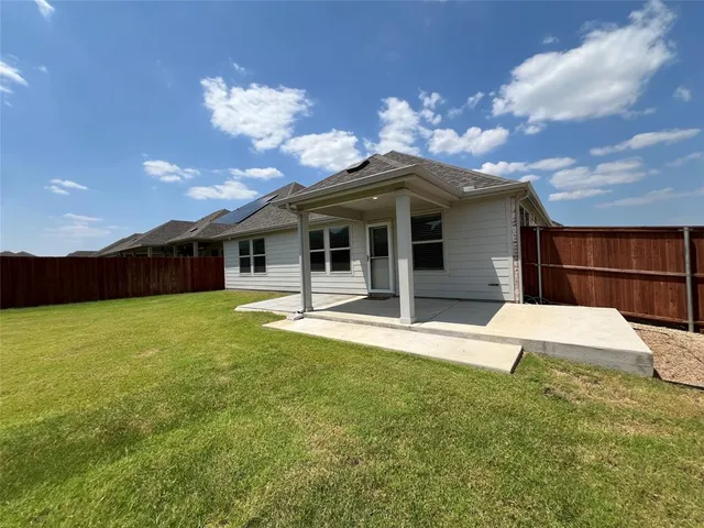a view of a swimming pool with outdoor seating