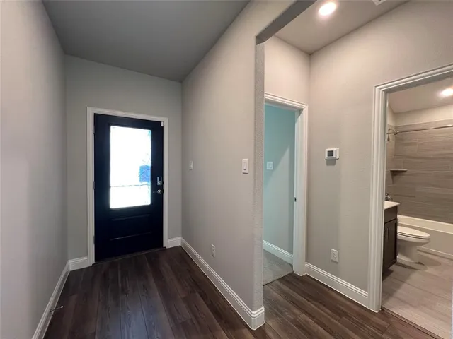a view of entryway with wooden floor