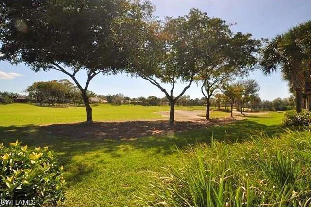a view of a lake with a big yard
