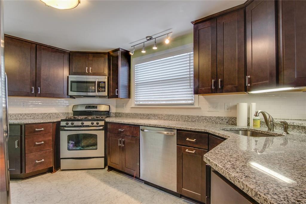 672 Center Road Pittsburgh, PA 15239 - Photo 13 of 25 Granite countertops and an abundance of cabinetry