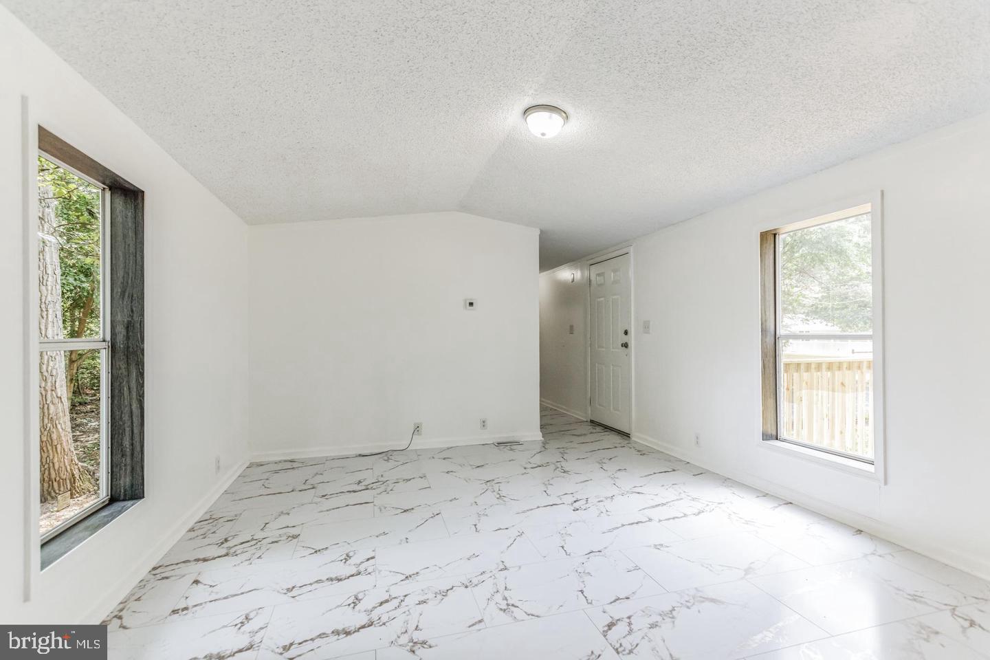 232 Jute Road Millville, NJ 08332 - Photo 14 of 30 an empty room with windows