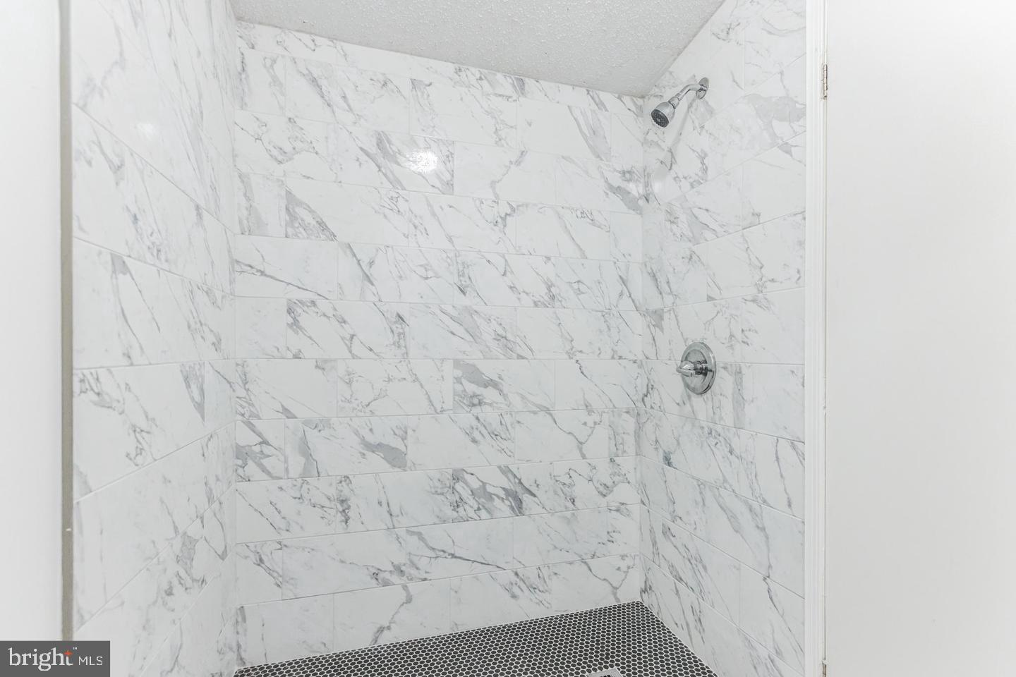 232 Jute Road Millville, NJ 08332 - Photo 17 of 30 a bathroom with a shower curtain
