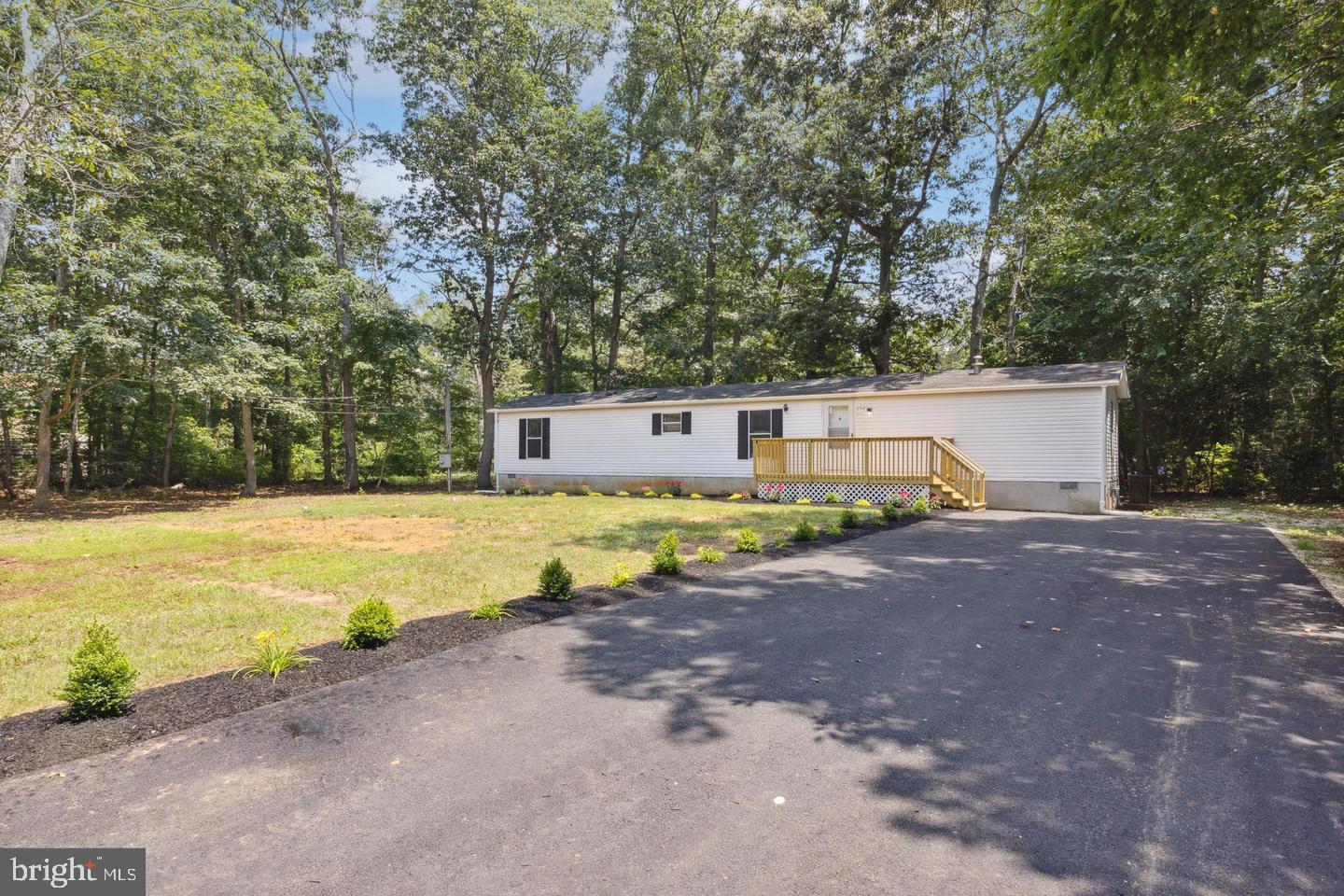 232 Jute Road Millville, NJ 08332 - Photo 2 of 30 a view of a house with swimming pool and sitting area