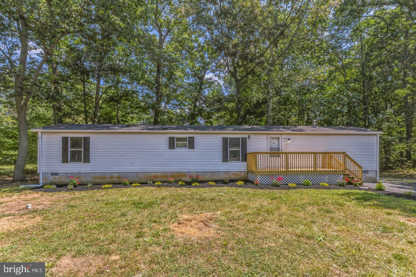 232 Jute Road Millville, NJ 08332 - Photo 3 of 30 a house that has a tree in front of it