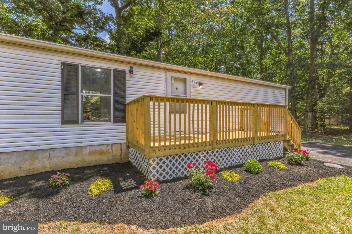 232 Jute Road Millville, NJ 08332 - Photo 4 of 30 a view of a backyard with a small garden