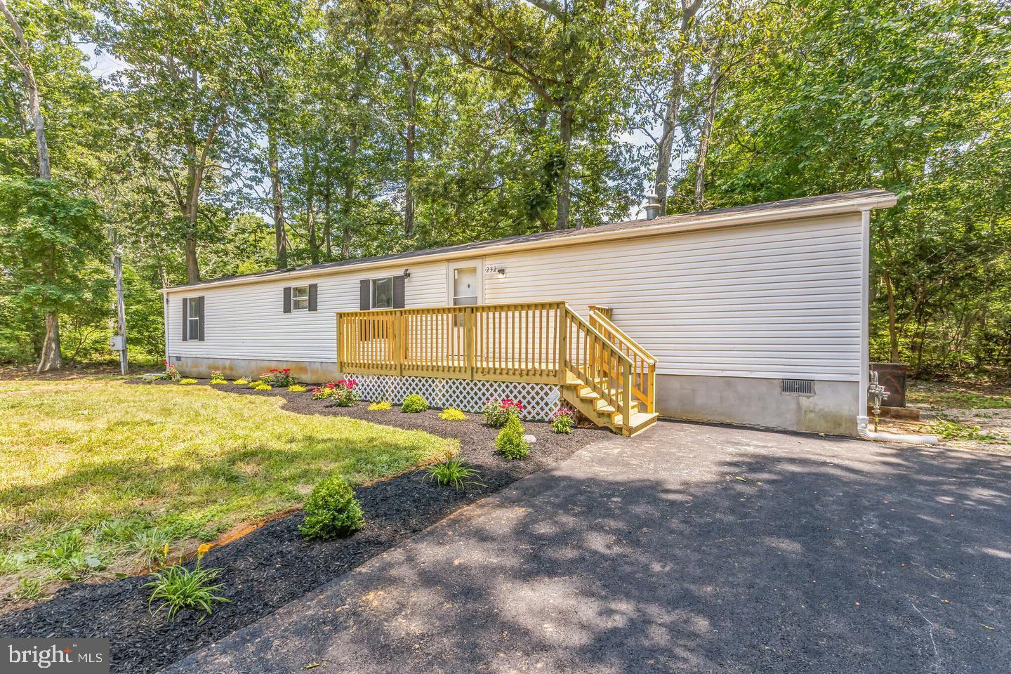232 Jute Road Millville, NJ 08332 - Photo 5 of 30 a view of a backyard with a small cabin
