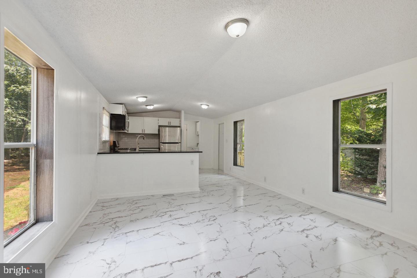 232 Jute Road Millville, NJ 08332 - Photo 7 of 30 a view of kitchen and front door