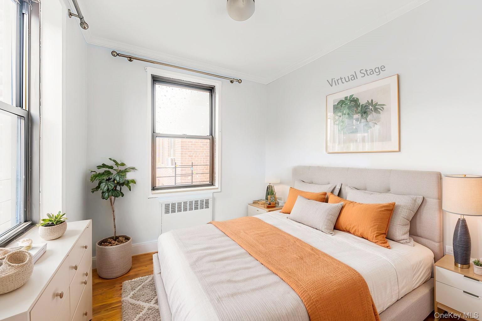 150-25 72nd Road, Unit 5K Queens, NY 11367 - Photo 15 of 21 a bedroom with a bed and a large window