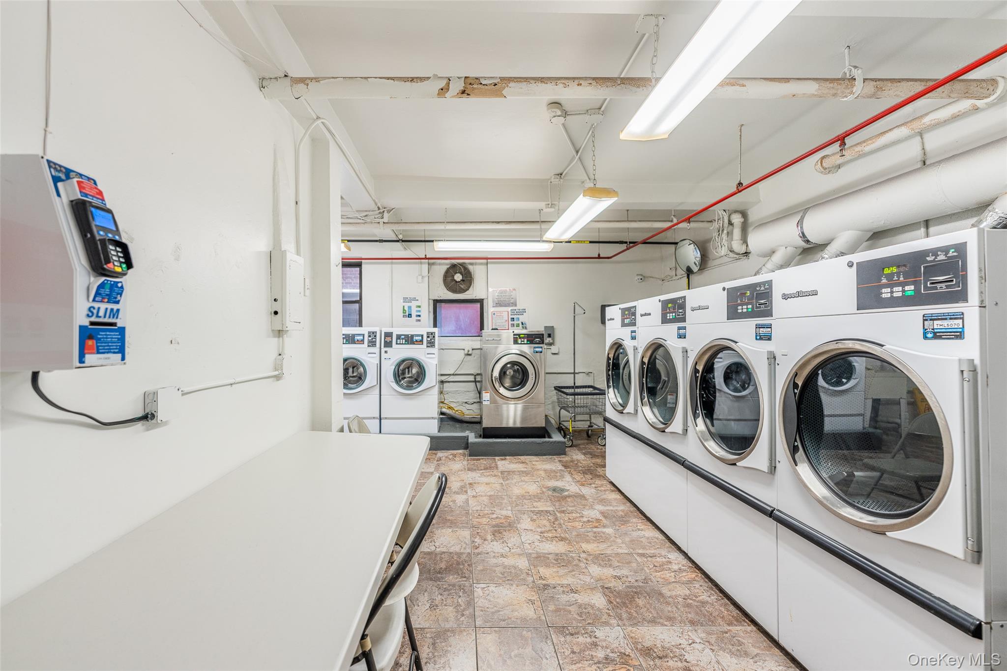 150-25 72nd Road, Unit 5K Queens, NY 11367 - Photo 18 of 21 a utility room with dryer and washer
