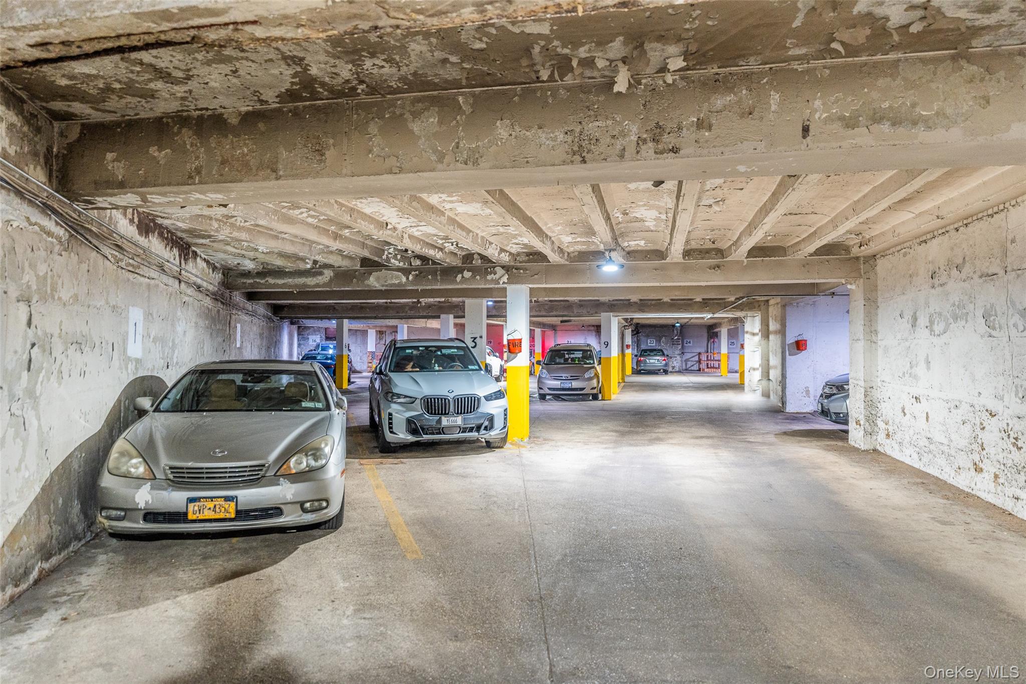 150-25 72nd Road, Unit 5K Queens, NY 11367 - Photo 19 of 21 a view of parking garage with cars
