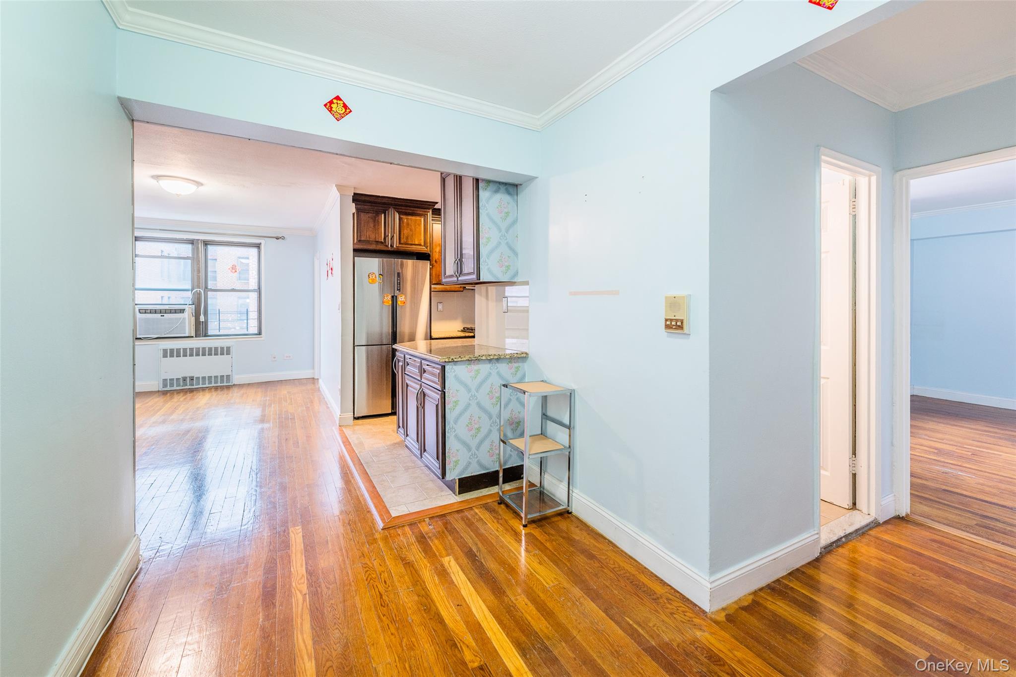 150-25 72nd Road, Unit 5K Queens, NY 11367 - Photo 4 of 21 a view of a room with wooden floor and furniture