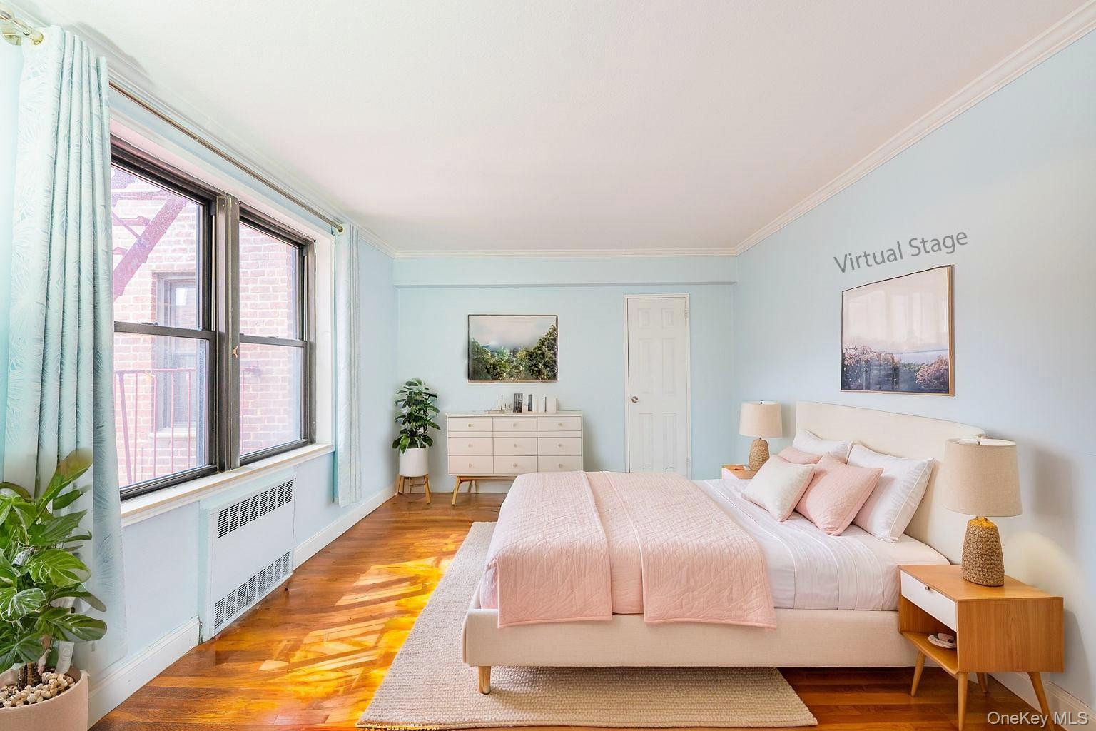 150-25 72nd Road, Unit 5K Queens, NY 11367 - Photo 5 of 21 a bedroom with a large bed and a large window