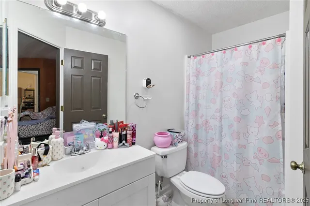 a livingroom with workspace and a window