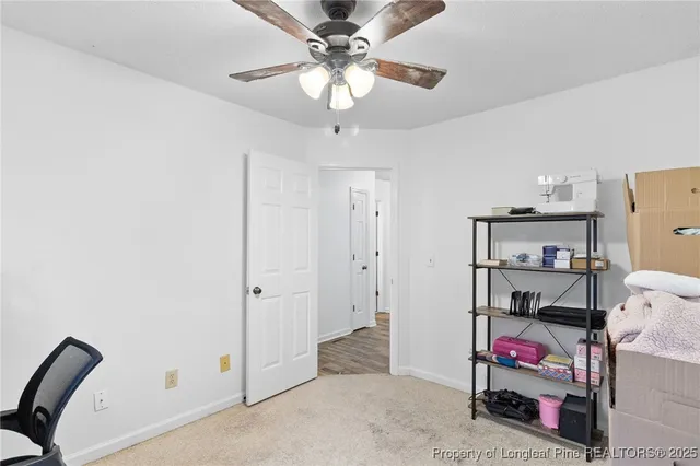 a bathroom with a sink a toilet and shower curtain
