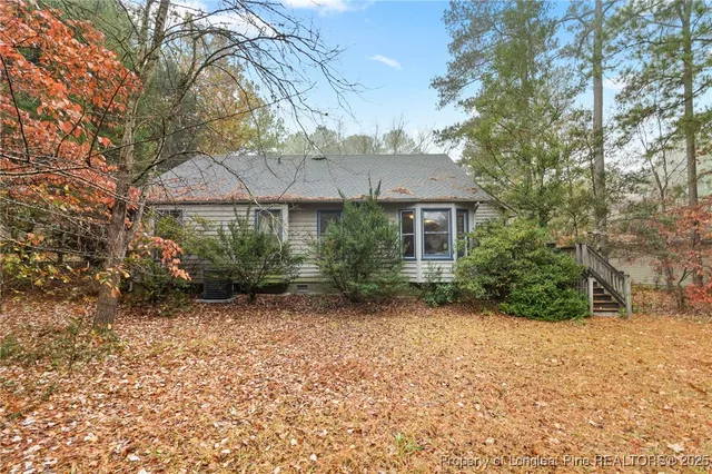 a view of a yard with a tree