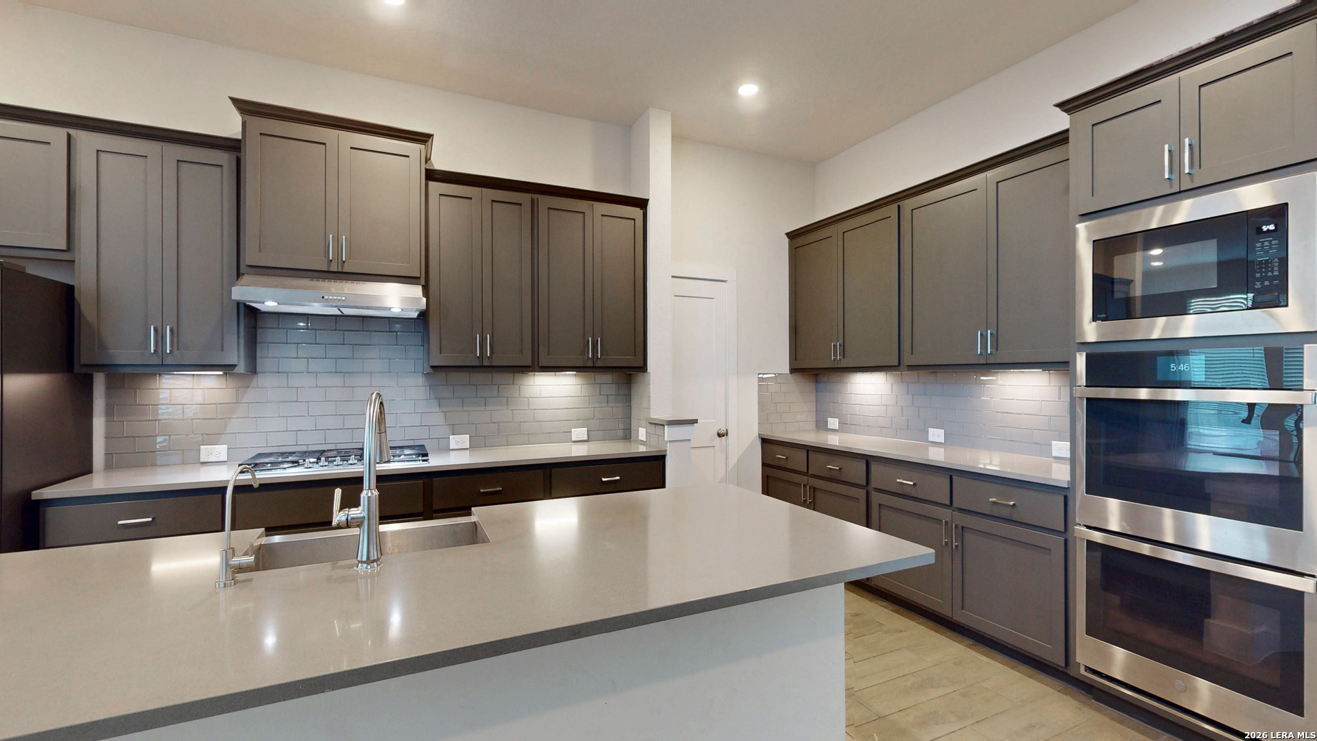 918 Rench New Braunfels, TX 78130 - Photo 14 of 41 a modern kitchen with stainless steel appliances granite countertop a sink and a stove