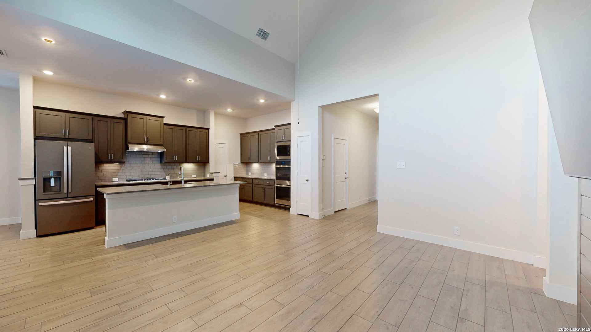 918 Rench New Braunfels, TX 78130 - Photo 15 of 41 a large kitchen with stainless steel appliances a refrigerator and a stove top oven