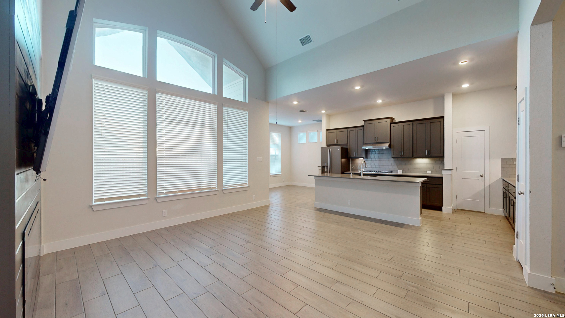 918 Rench New Braunfels, TX 78130 - Photo 16 of 41 a view of kitchen with stainless steel appliances kitchen island wooden floor and window