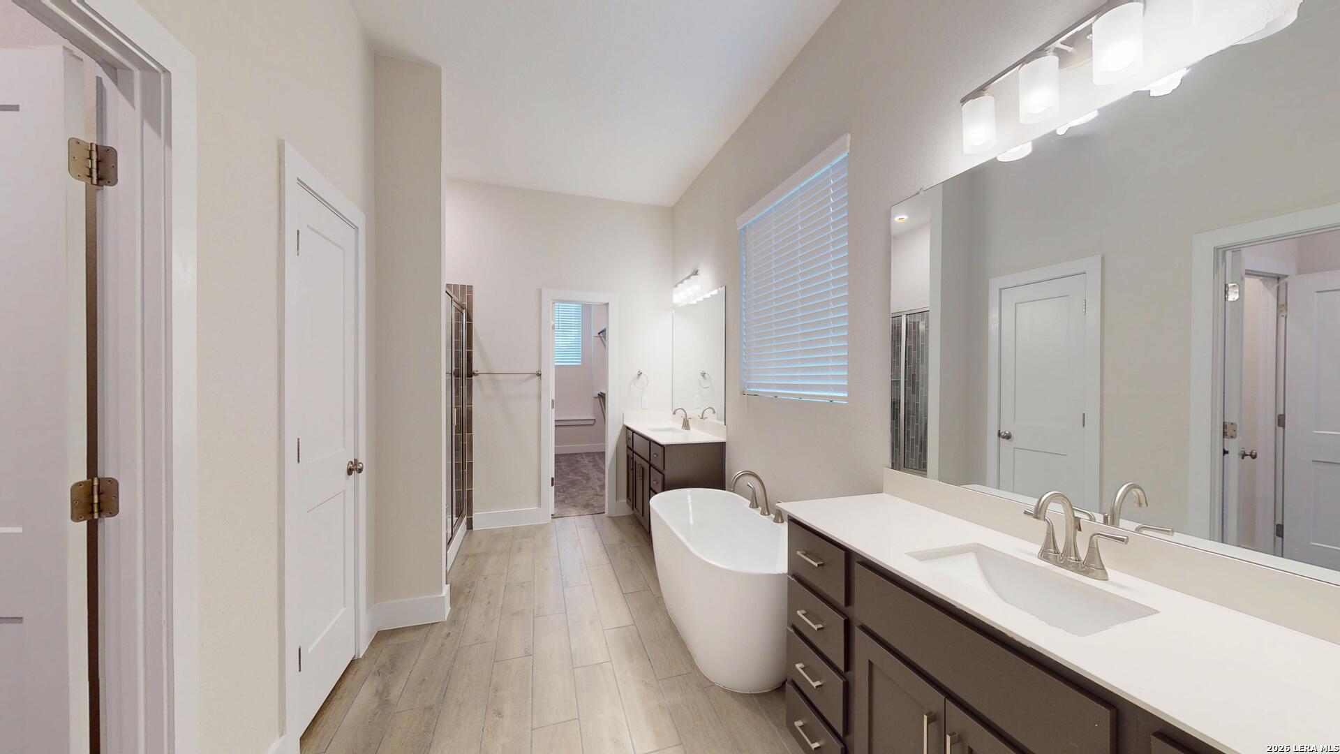 918 Rench New Braunfels, TX 78130 - Photo 19 of 41 a spacious bathroom with a double vanity sink mirror and double