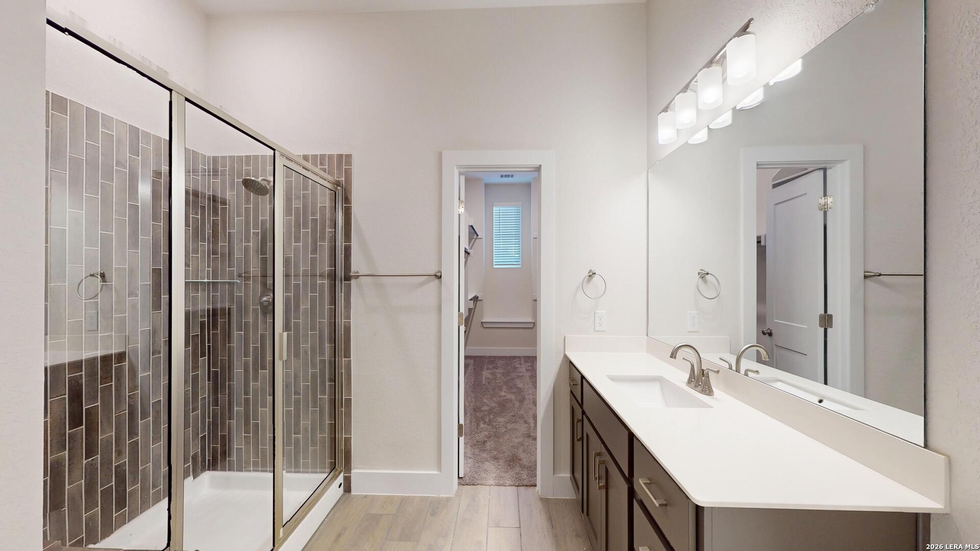 918 Rench New Braunfels, TX 78130 - Photo 21 of 41 a bathroom with a double vanity sink mirror and shower
