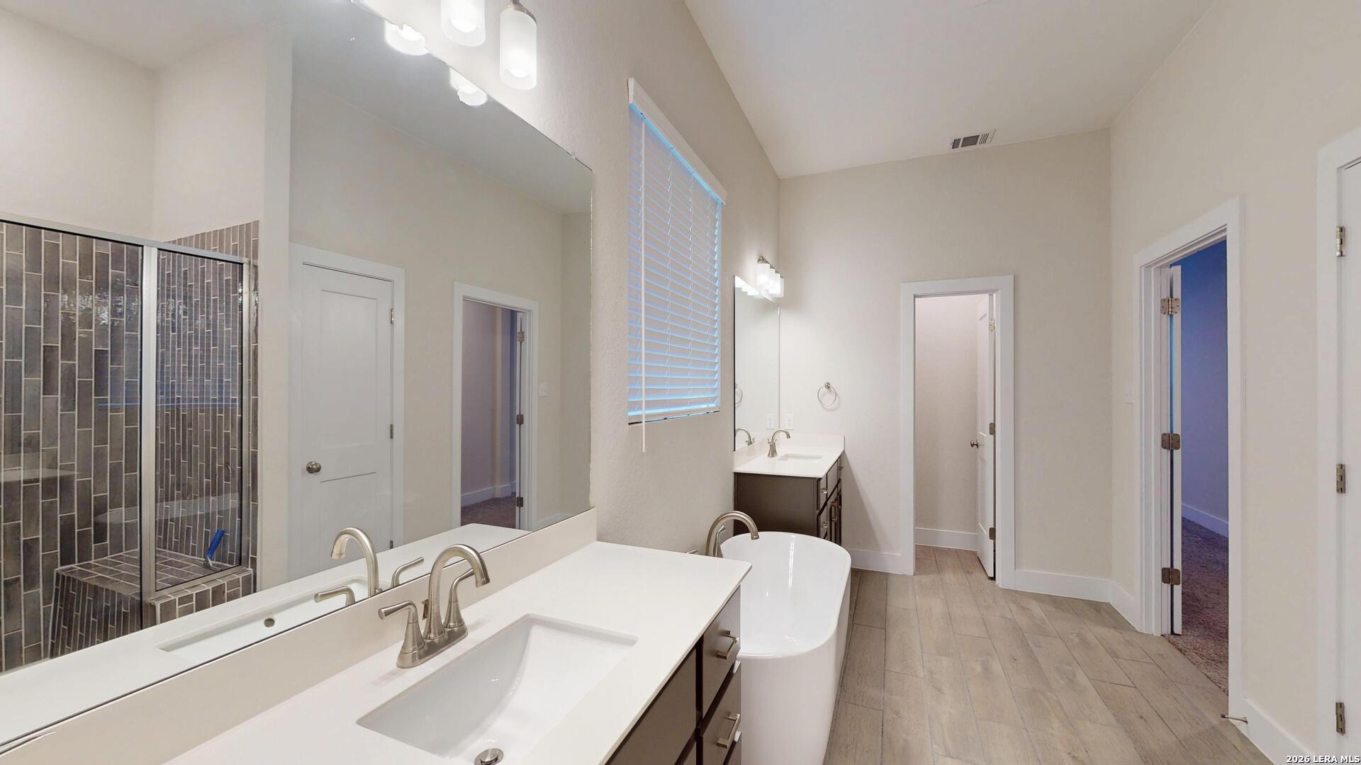 918 Rench New Braunfels, TX 78130 - Photo 23 of 41 a bathroom with a sink and a mirror