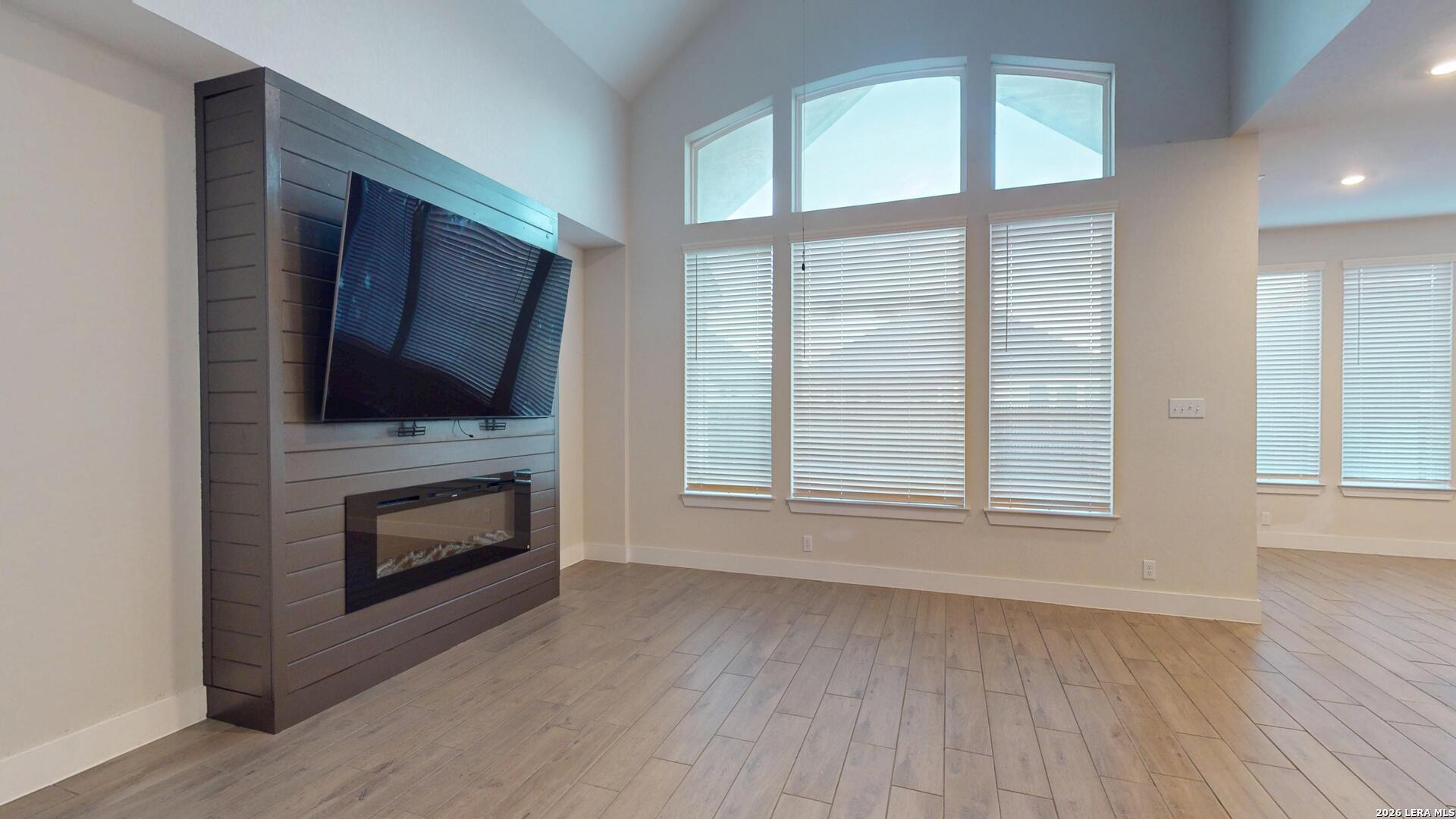 918 Rench New Braunfels, TX 78130 - Photo 25 of 41 a living room with fireplace furniture flat screen tv and window