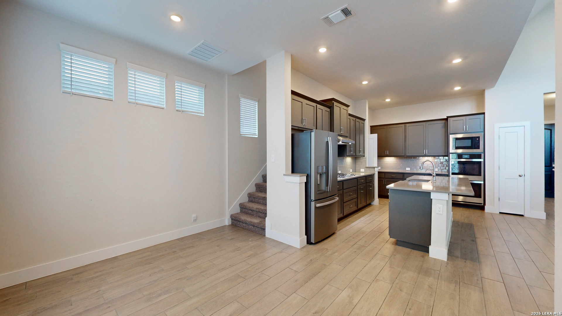 918 Rench New Braunfels, TX 78130 - Photo 26 of 41 a kitchen with a refrigerator and a stove top oven