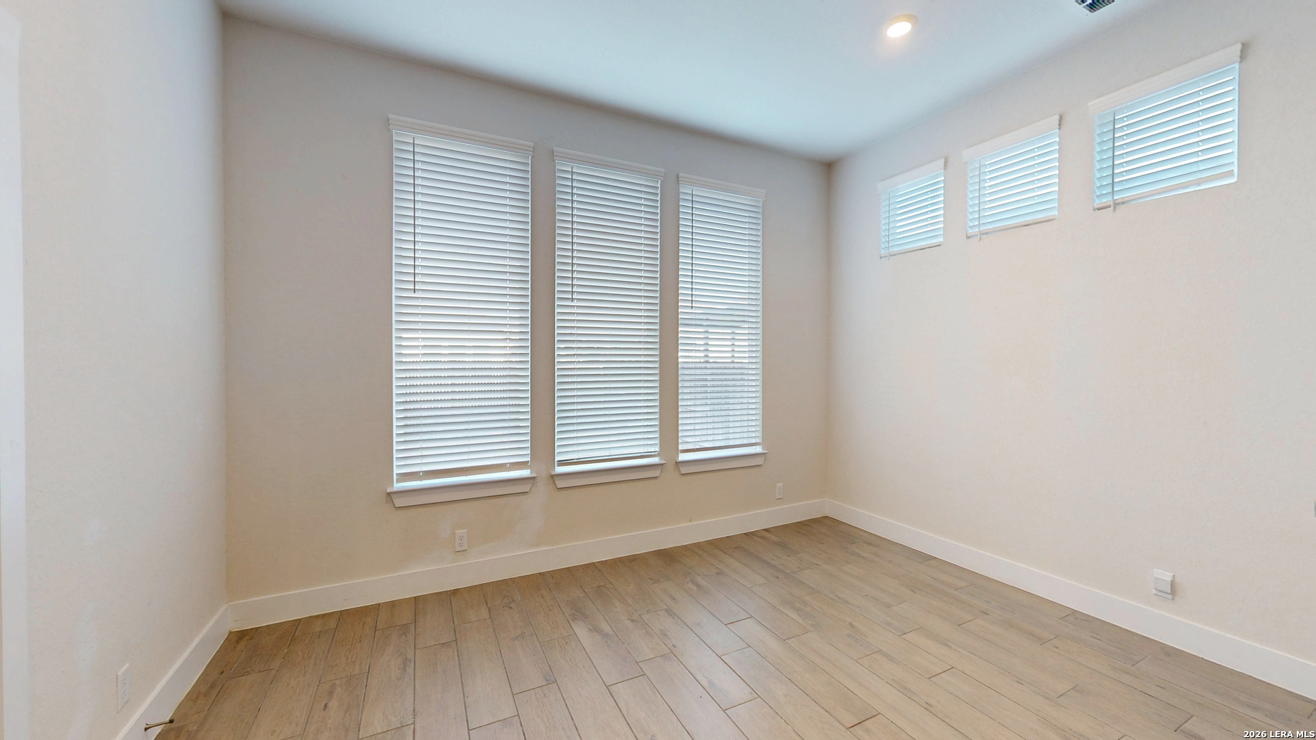 918 Rench New Braunfels, TX 78130 - Photo 28 of 41 an empty room with wooden floor and windows