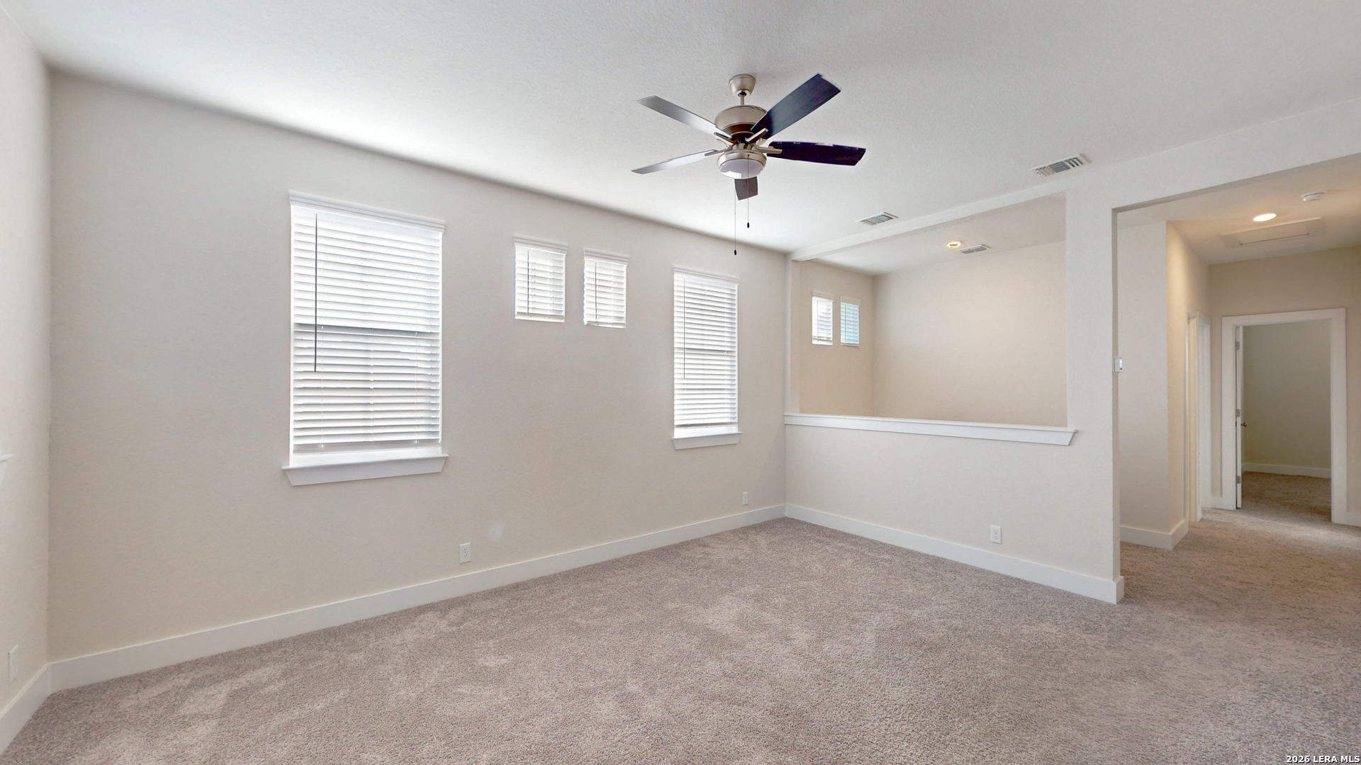 918 Rench New Braunfels, TX 78130 - Photo 29 of 41 a view of a livingroom with a ceiling fan & windows