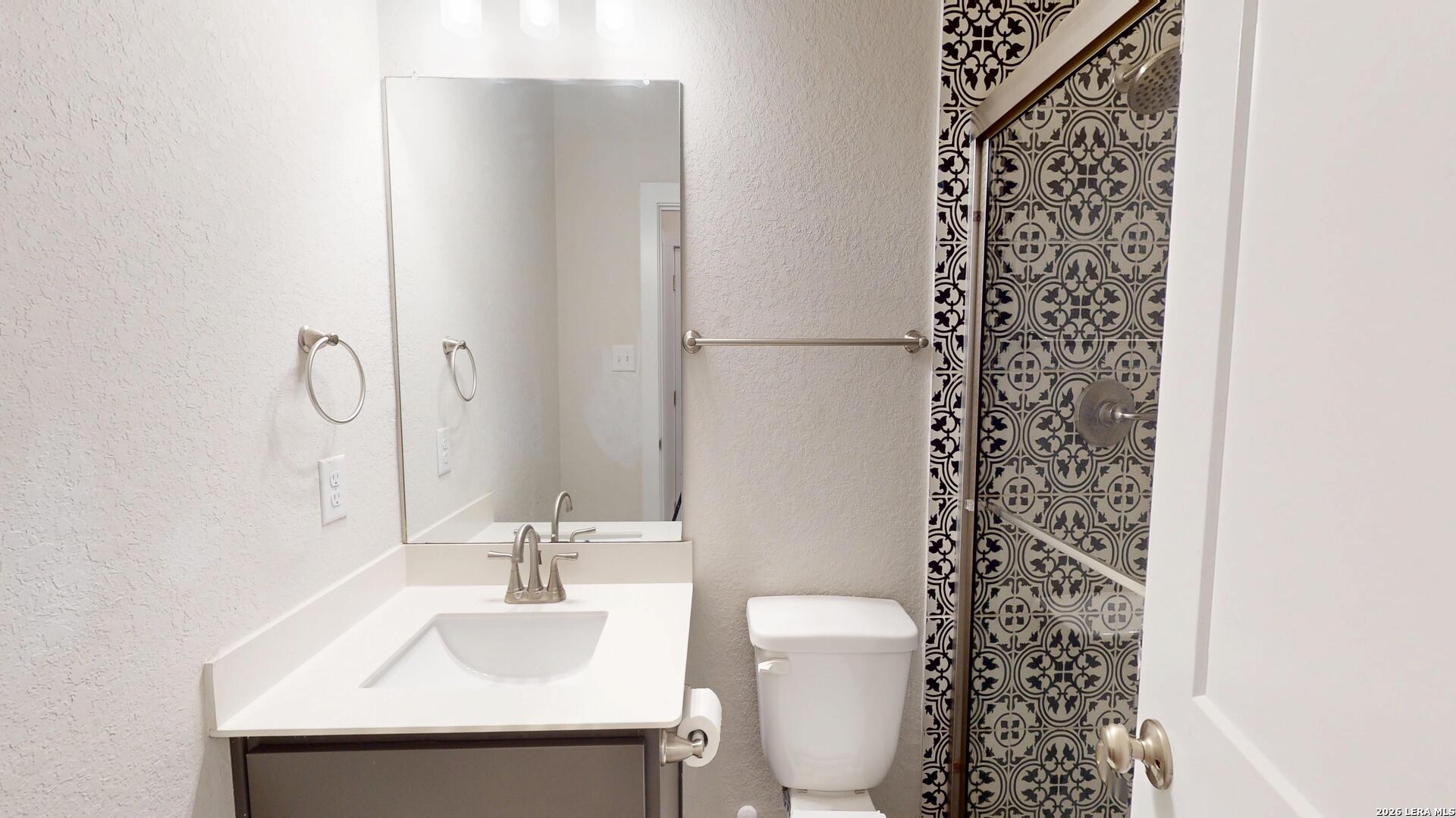 918 Rench New Braunfels, TX 78130 - Photo 5 of 41 a bathroom with a sink toilet and shower