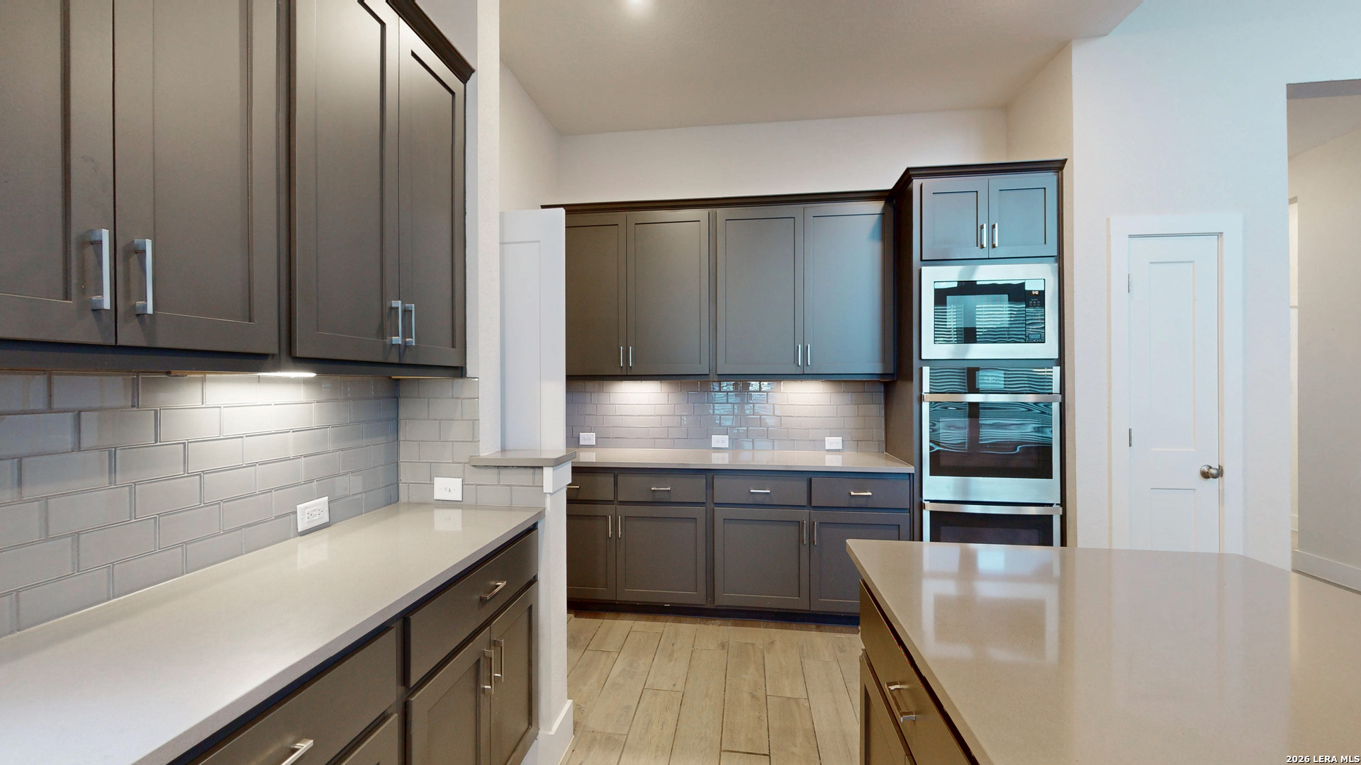 918 Rench New Braunfels, TX 78130 - Photo 10 of 41 a kitchen with stainless steel appliances granite countertop a sink and wooden cabinets