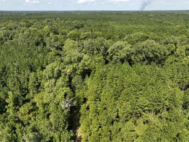 a view of a field with an outdoor space
