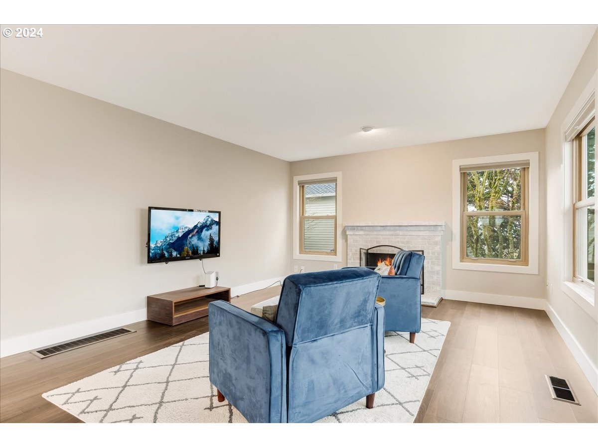 1812 Southwest Nancy Drive Gresham, OR 97080 - Photo 13 of 39 a living room with furniture and a flat screen tv