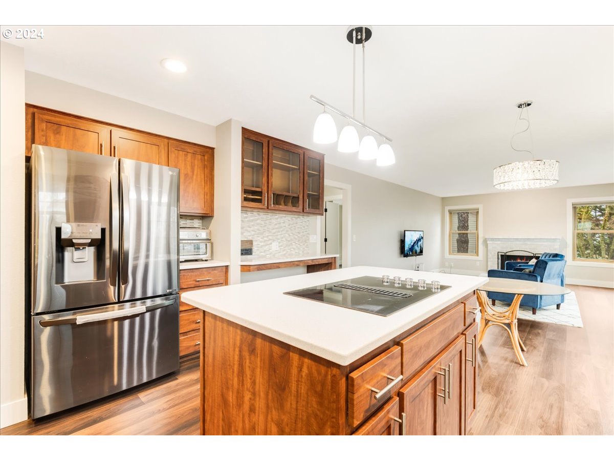 1812 Southwest Nancy Drive Gresham, OR 97080 - Photo 17 of 39 a kitchen that has a lot of cabinets a sink and appliances in it