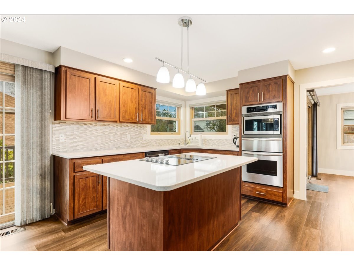 1812 Southwest Nancy Drive Gresham, OR 97080 - Photo 18 of 39 a kitchen with a stove a sink and a microwave
