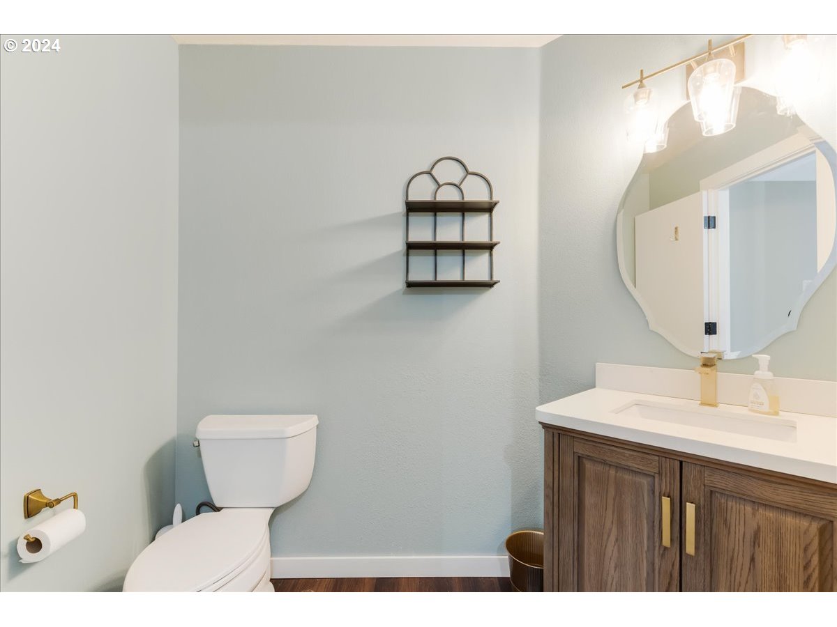1812 Southwest Nancy Drive Gresham, OR 97080 - Photo 20 of 39 a bathroom with a sink toilet and mirror