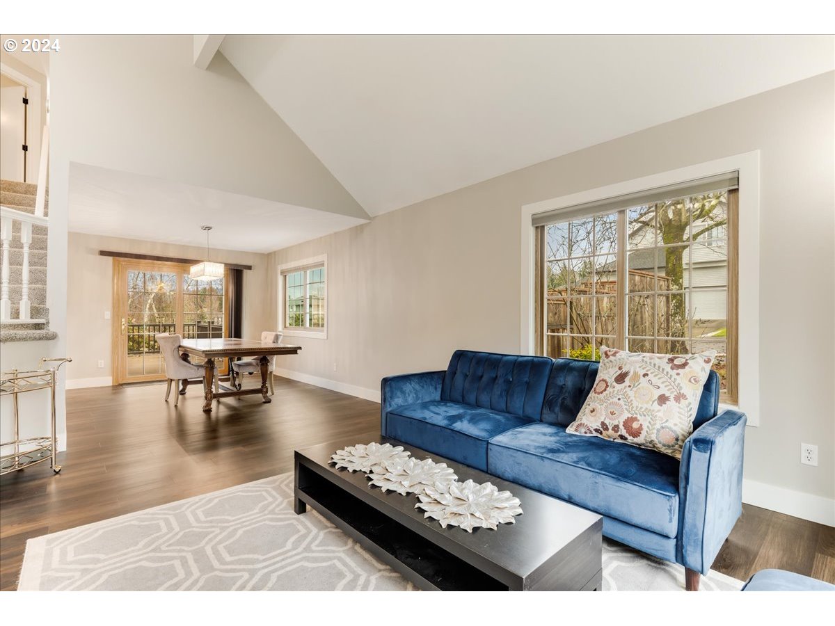 1812 Southwest Nancy Drive Gresham, OR 97080 - Photo 8 of 39 a living room with furniture and wooden floor next to a window